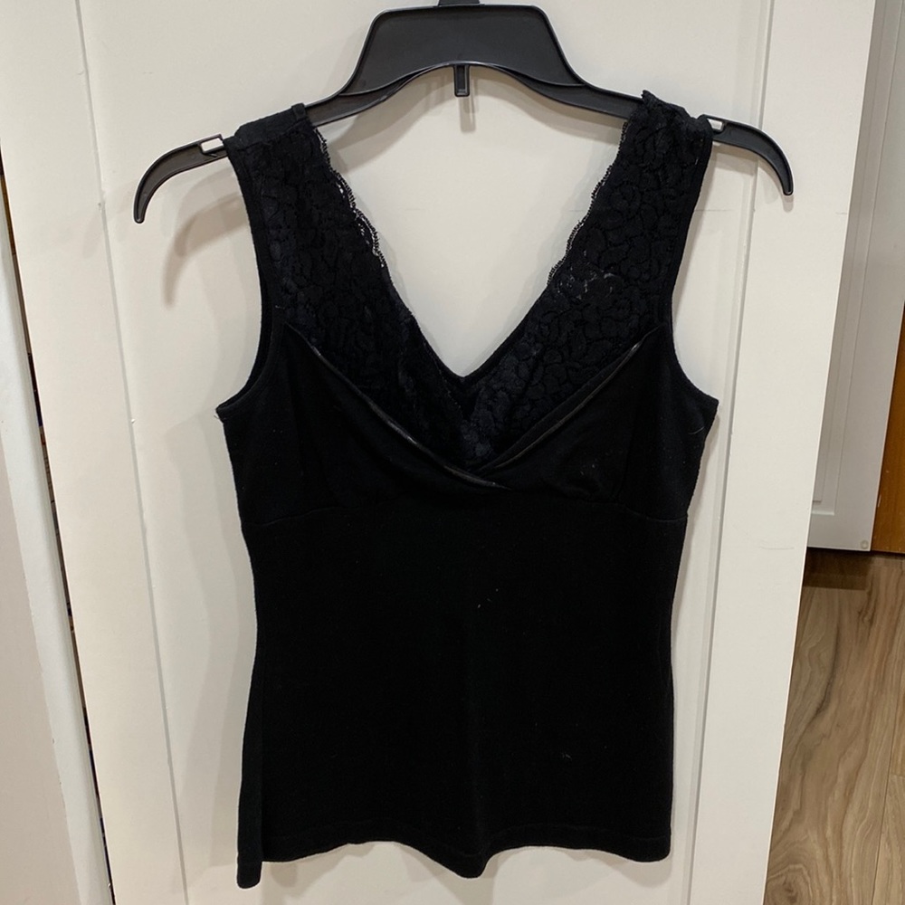 Black sleeveless top.